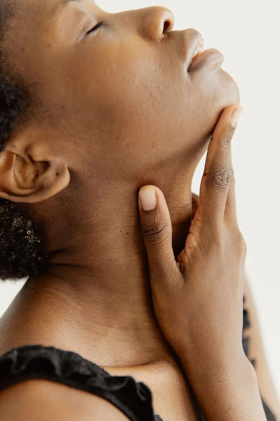 Woman with smooth, firm skin along the jaw and neck